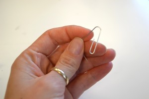 hand holding paper clip