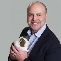 A man holds a guinea pig