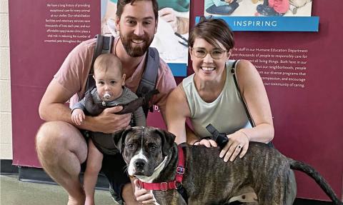 A family with a dog at The Anti-Cruelty Society