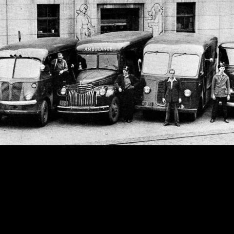 Five old vehicles parked outside The Anti-Cruelty Society building in the 1920's